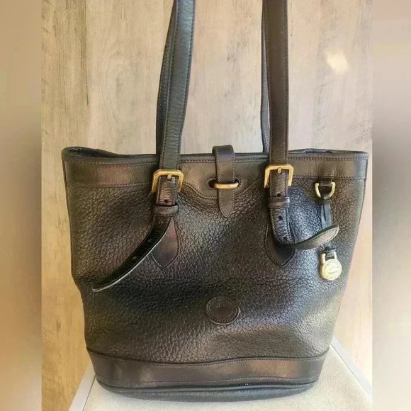 Dooney & Bourke Small Black Bucket Bag from the Metro Collection Vintage Gold - Picture 1 of 14